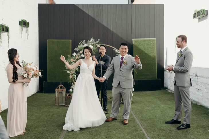 Bride and Groom at Outdoor Loft Ceremony, Officiant, Bridal Party in Pastels