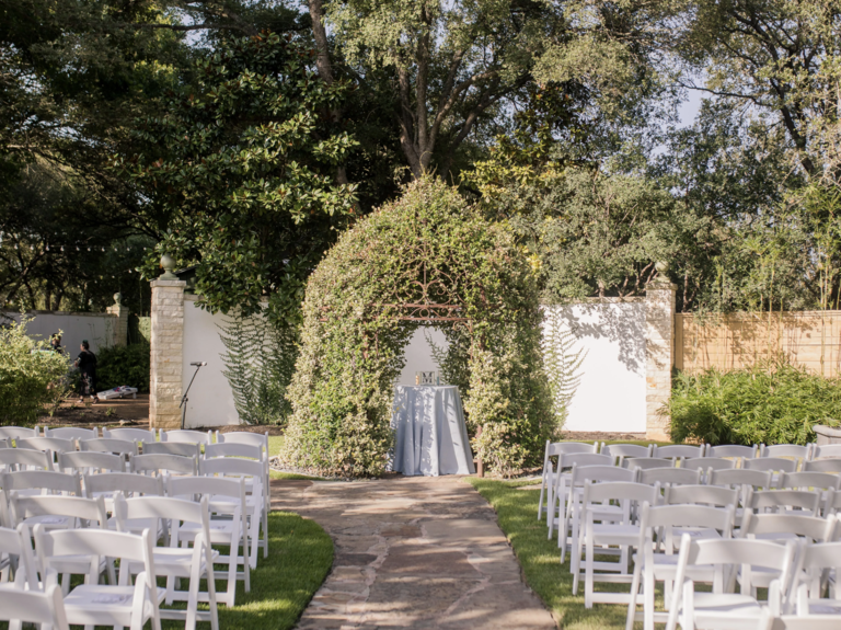 Outdoor ceremony space with greenery altar at Hummingbird House wedding venue in Austin, Texas
