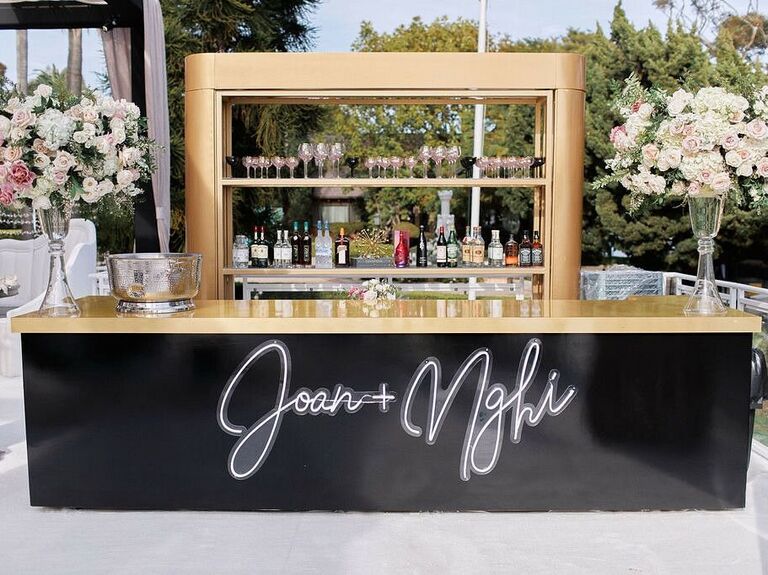 Personalized bar space with wedding couple names in neon