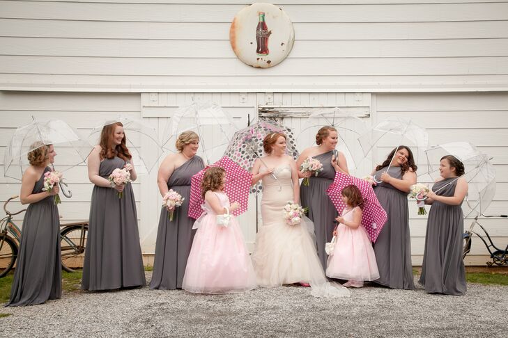 During pictures, Lindsey's bridesmaids used bright pink and clear umbrellas to shield their steel gray long gowns.