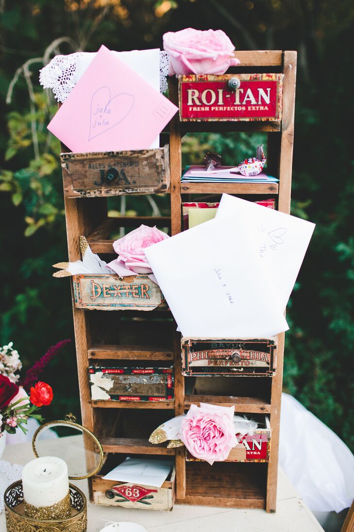 Guests could leave cards inside a cubby made from antique cigar boxes.