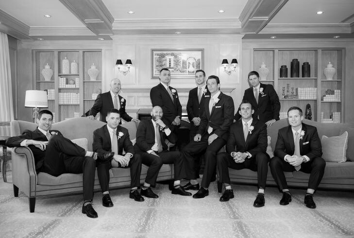 Dan and his groomsmen wore navy suits with accents of pink in their ties and blue and gray camouflage pocket squares.