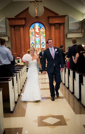 Newlyweds Recess Down the Aisle in a Church