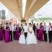 For the Western wedding reception at A'Bulae in St. Paul, Minnesota, the bridesmaids donned black lace and plum satin dresses from the Dessy collection. The groomsmen wore Michael Kors suits from Savvi Formalwear. The attire included white skirts, purple skinny ties, black slacks and suspenders.