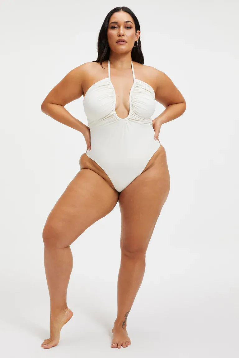 white one piece with halter top and low neckline