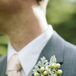 The men's boutonnieres were a masculine combination of hypericum berries and dusty miller.