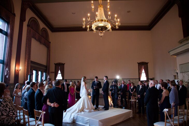 With 160 guests, Clint and Kelly hoped for intimate nuptials by creating their ceremony in the round. Their dear friend officiated the wedding as they exchanged their vows under the venue's historic chandelier.