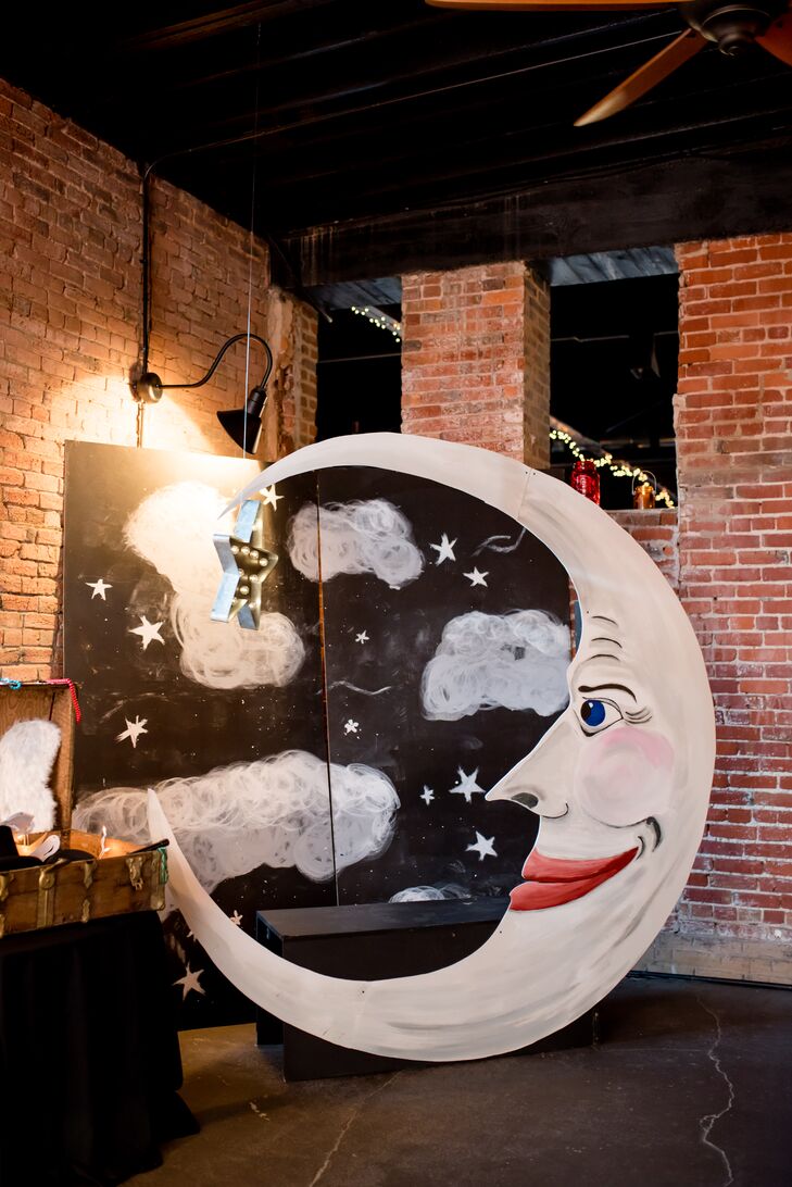 A hanging-moon photo booth was a nod to Maggie and Doug's wedding logo, which their friend Missy designed and they used as a design element on their paper products and favors.