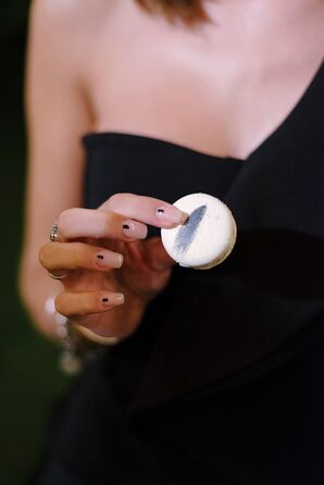 Hand With Modern Manicure Holding Macaron