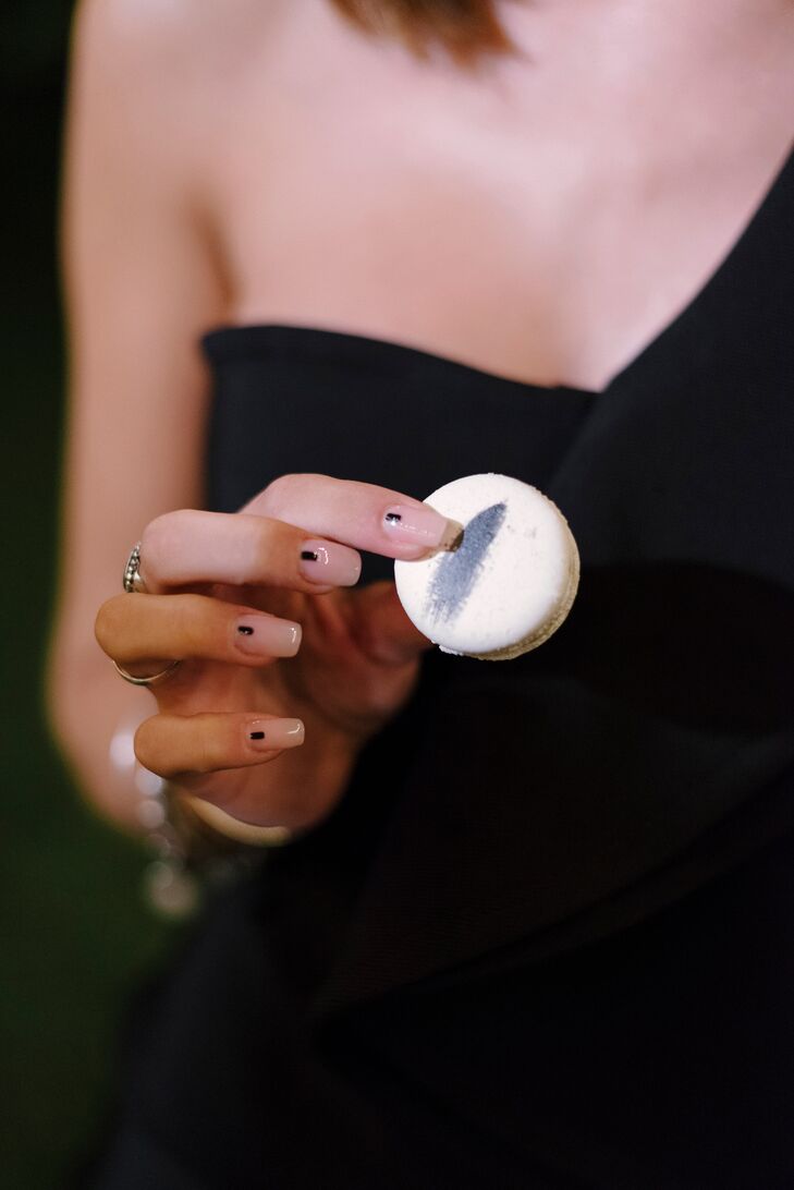Hand With Modern Manicure Holding Macaron
