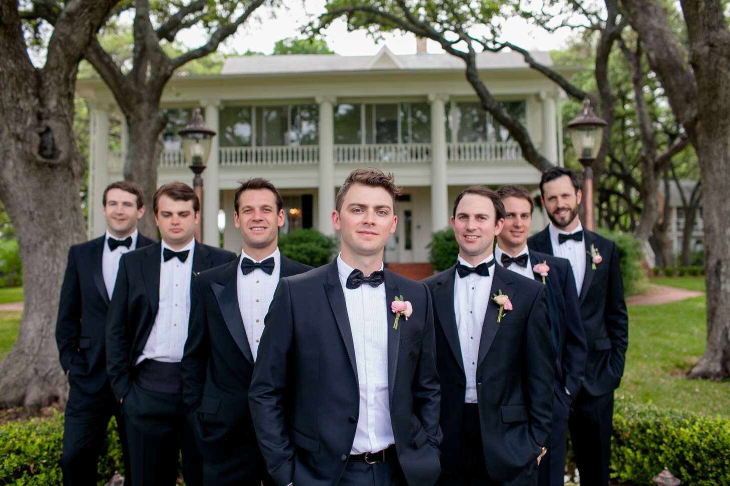 Black Gucci Groomsmen Suits with Bow Ties and Blush Boutonnieres