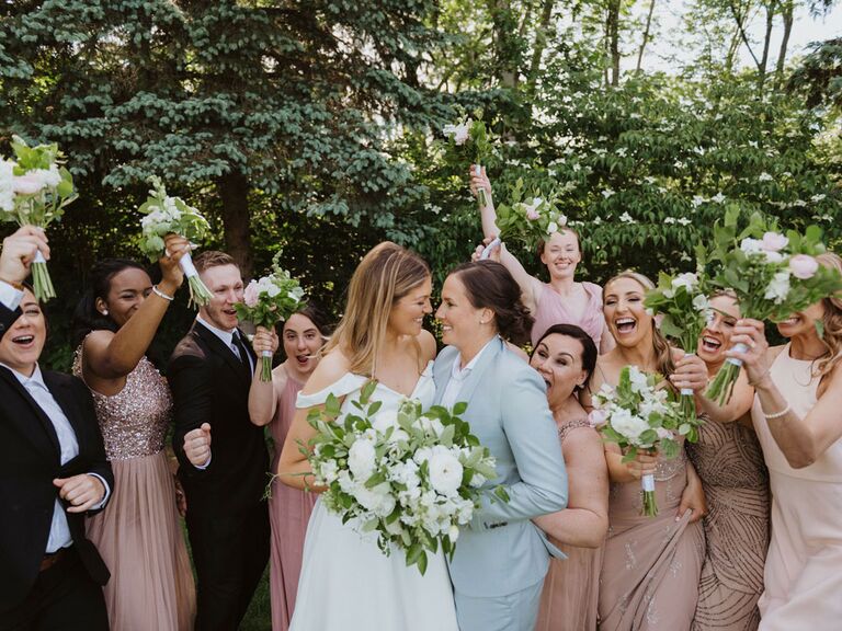Funny bridesmaid picture with groomsmen and couple