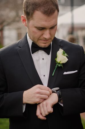 Groom in Black Bow Tie and White Rose Boutonniere
