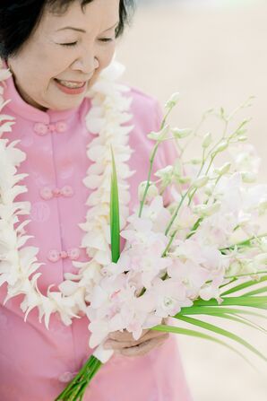 Bride in Pink Tang Suit, Lei and Blush Pink Orchid Bouquet for Vow Renewal