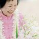 Bride in Pink Tang Suit, Lei and Blush Pink Orchid Bouquet for Vow Renewal