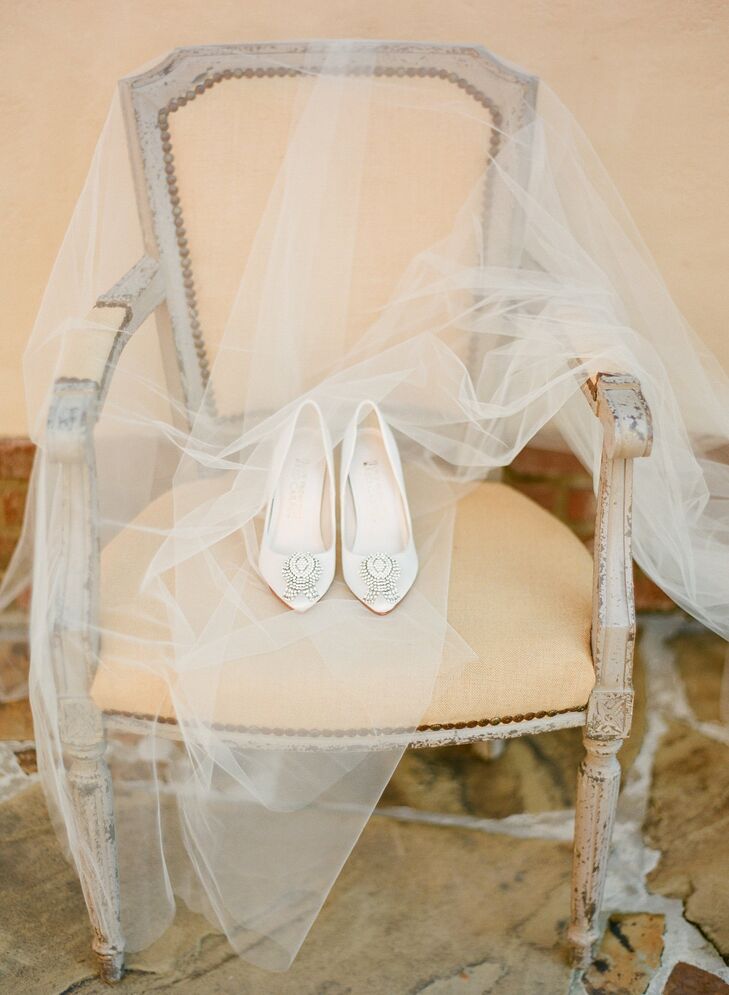 to complement her classic look, Jessica opted for a pair of ivory satin pointed-to pumps with crystal embellishments.