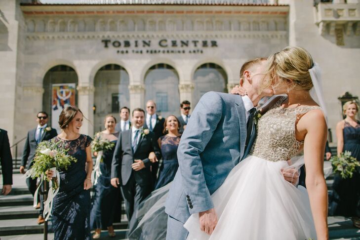 Luke did not want a black-tie feel. It was important to him that instead of a tux, he wear something a little more casual. The groom and his groomsmen donned modern slate gray Burberry suits for a classic look.