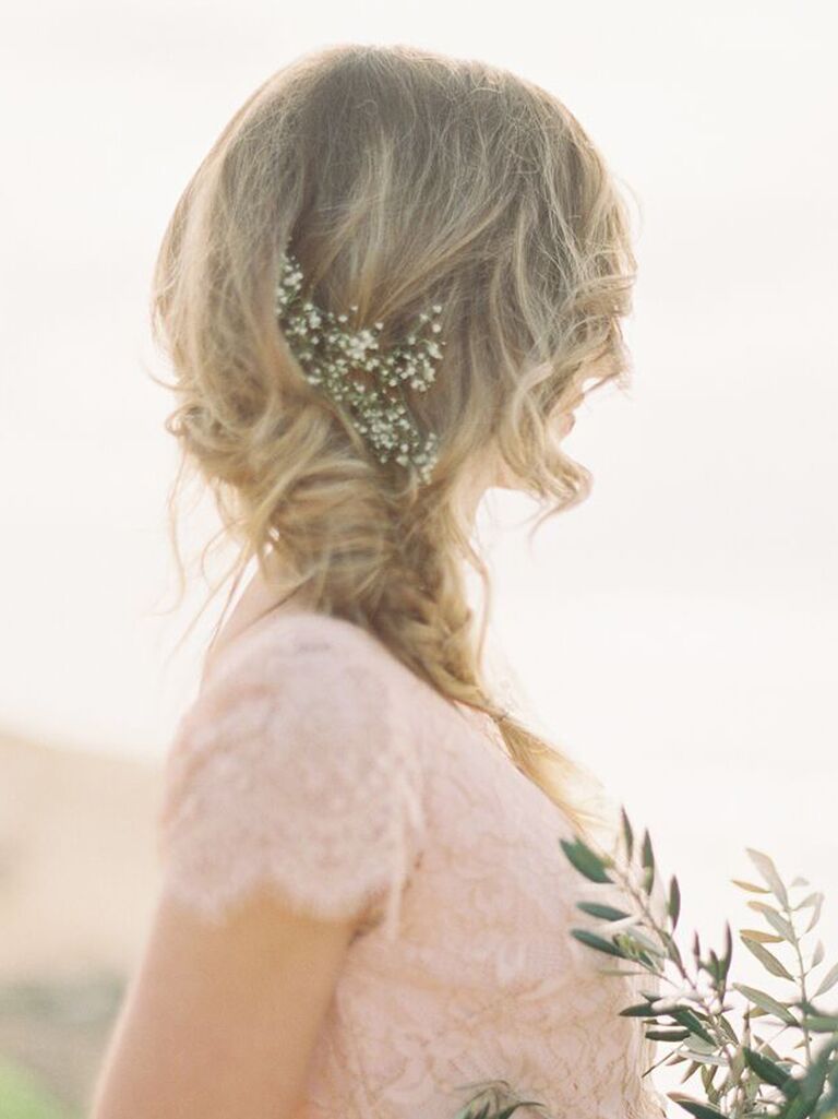 side hairstyles for wedding fishtail braid with flowers