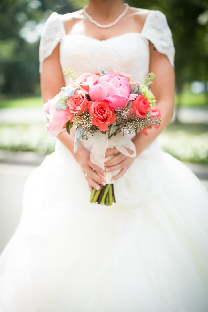 Peonies are one of Mallory's favorite flowers, so having them in her bouquet was a must. Bright pink peonies, red roses, baby's breath and green hydrangeas filled her bouquet.