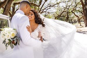 Bride and Groom Both in White Wedding Attire and Vintage Car
