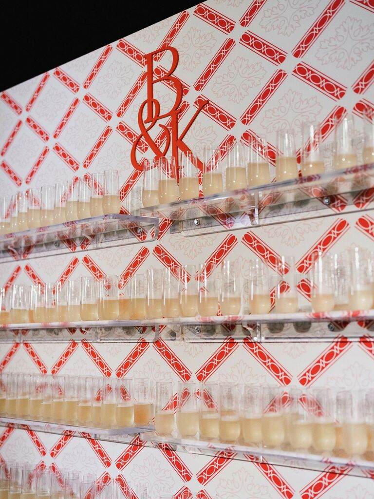 wedding champagne wall with red and white grid backdrop