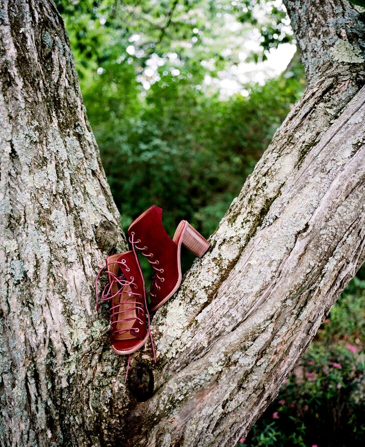 Gina’s dress wasn’t the only vintage-inspired part of her look. She paired the lace Claire Pettibone gown with a pair of burgundy, lace-up bootees by Jeffrey Campbell. Complete with an exposed heel and front, the shoes also showed off her bohemian style with a burst of color.
