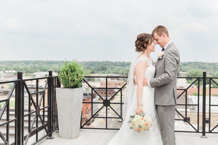 Amber and Adam were married atop SkyDeck, a rooftop bar in downtown Kalamazoo, Michigan. The space offered spectacular views of the city to their guests.