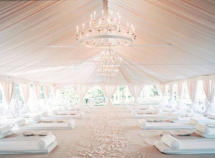 Tented Ceremony Space With White Draping and Chandeliers