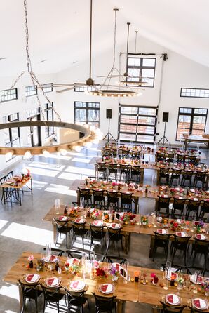 Reception With Wood Farm Tables at Northstar Gatherings in Idaho Springs, Colorado