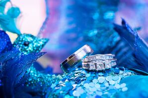Silver Wedding Rings Atop Peacock Accent