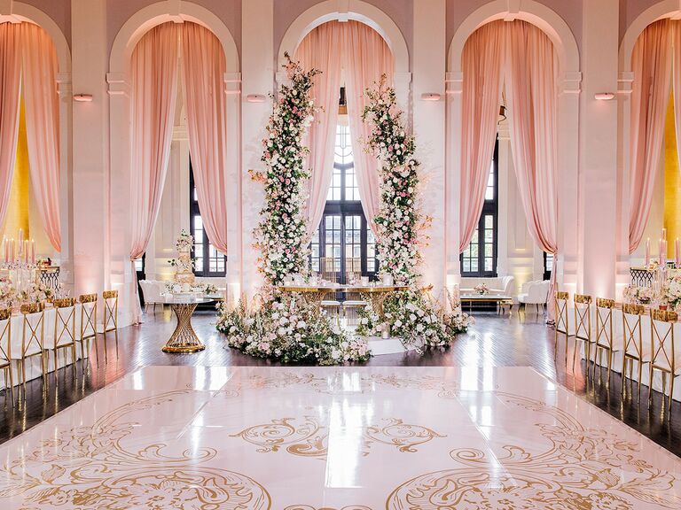 Pink monogrammed dance floor at fairytale wedding
