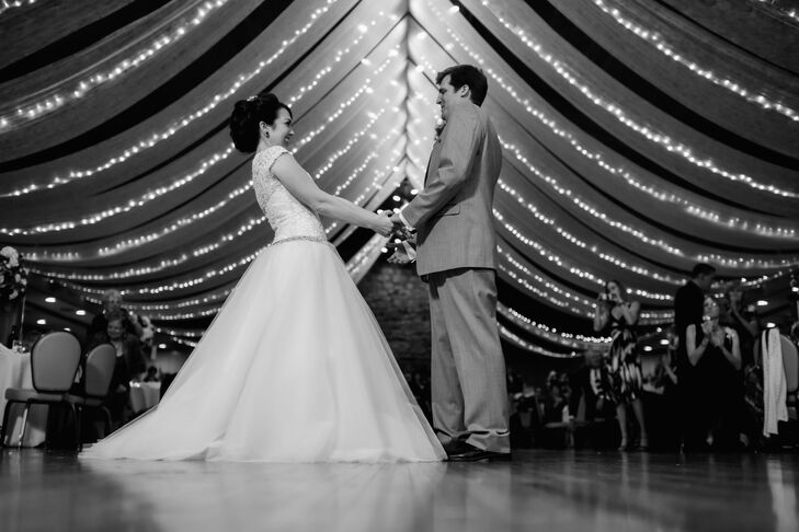 As Anna and Brandon danced around the ballroom, Anna's ball gown designed by Elegance by Roya Couture flowed with their movements. Beaded lace covered the bodice, stopping at the thin silver belt accented with gemstones.