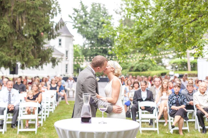 Anna and Tyler shared their first kiss as a married couple in front of their guests at J.E. Reeves Victorian Home and Museum in Dover, Ohio. On the day of the wedding, Anna wore her hair in an elegant updo with a crystal headband.