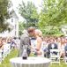 Anna and Tyler shared their first kiss as a married couple in front of their guests at J.E. Reeves Victorian Home and Museum in Dover, Ohio. On the day of the wedding, Anna wore her hair in an elegant updo with a crystal headband.