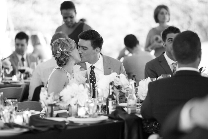 Inspired by the 1920s, Tiffany worked with La Jolie Salon and Spa to style her hair into a vintage look. Her side bang curled into a finger wave updo for a classic style. The silver art deco-worthy pins from Nordstrom enhanced her look. She looked nothing short of classic as she and Joe shared a kiss during the reception.