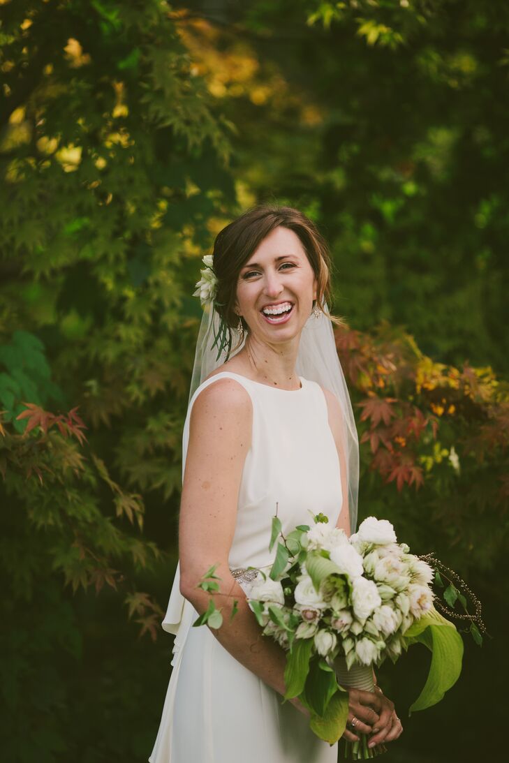 For their florals, Erin and Tyler tapped the talent of close friend Danielle Bernhisel. “Wild, organic, not fussy and completely natural was the brief,” Erin says. “She ordered the perfect flowers, then ended up being so inspired by the grounds of the property that a good amount of the greens in our flowers came from it. Both my headpiece and bouquet were stunning. Flowing, free and alive, they captured the spirit of our wedding perfectly.”
