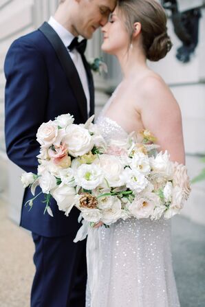 Bride Carries Large Cascading Bouquet of Roses