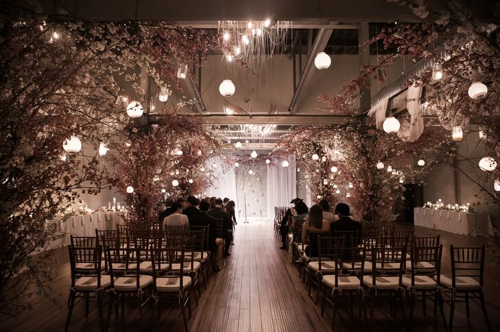 The ceremony at Front & Palmer was jaw-dropping, with hanging lanterns and cherry blossom trees lining the aisles and beautiful chandeliers hanging from beams. It was a gorgeous combination of industrial and romantic.