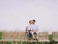 Couple share a sweet kiss at their engagement photo shoot. 