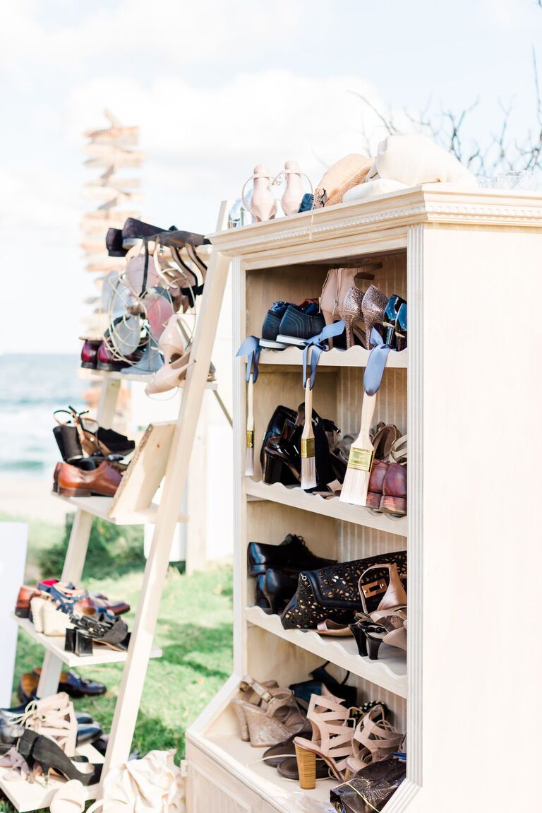 Shelves for shoe check at beach wedding