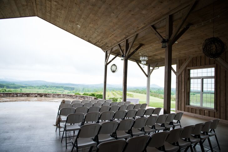 "Our wedding theme was all about reflecting the mountains around us," says Rachel. "We choose a beautiful outdoor venue that was filled with natural decoration- the vineyards, the soaring roof of the barn and the Mason jar chandeliers hanging from the rafters."