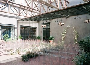 Light and Airy Ceremony Setup with Ghost Chairs at Texas Wedding