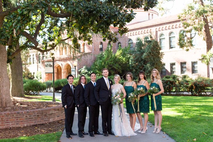 “Annie chose matching bridesmaid dresses that also displayed spectacular beading in shades of dark teals and greens,” the couple says. “The groomsmen wore simple and sleek black suits and ties to match the bridesmaid dresses.”