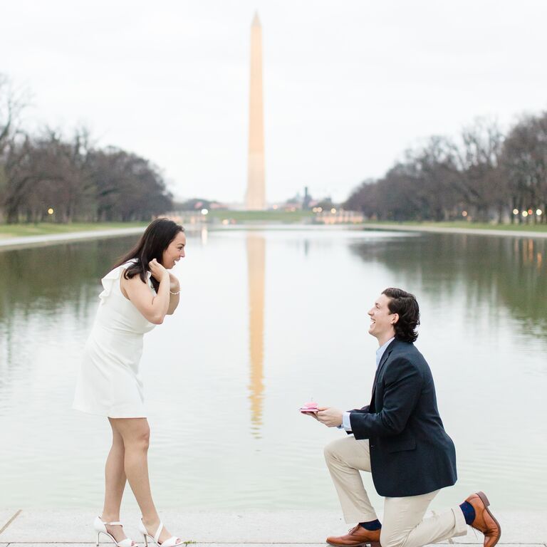 Man proposing to woman in front of Washington Monument in Washington, DC