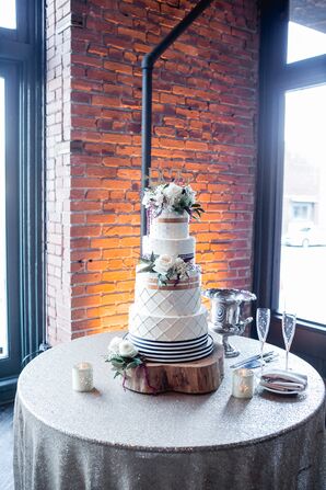 Striped Four-Tier Cake with Decorative Piping