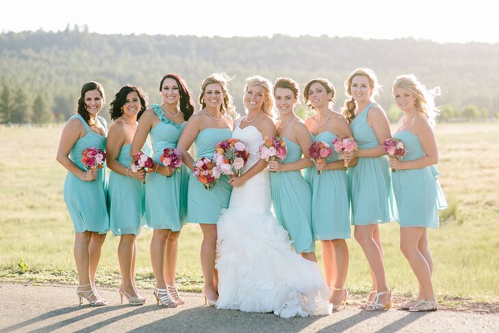 The bridesmaids wore turquoise dresses in various styles by Bill Levkoff with their own silver shoes.