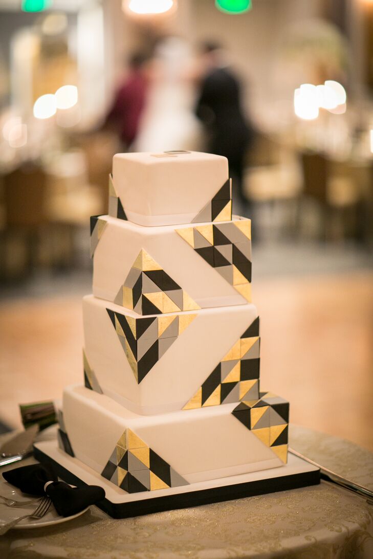 The wedding cake was designed by La Cakerie. it was decorated in black and gold art deco designed squares.  The bride and groom cut it with a sword as a tribute to Randy's time in the army.