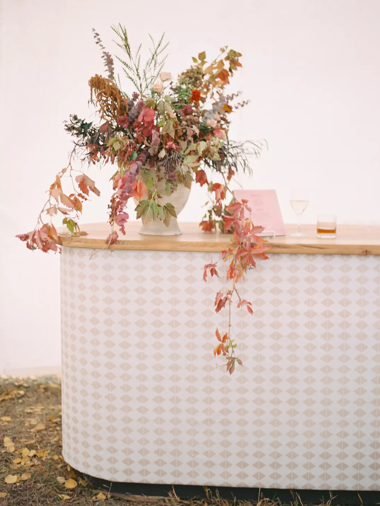 A beautiful autumnal flower arrangement of multicolored fall leaves.