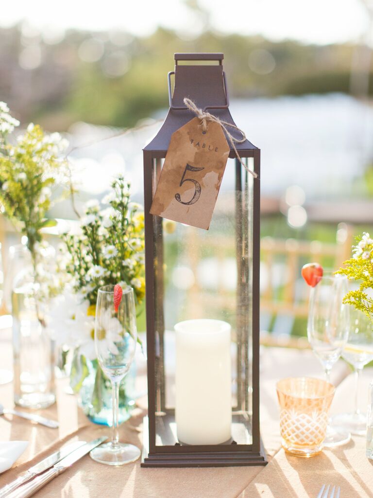 rustic wedding table number idea with bronze lantern