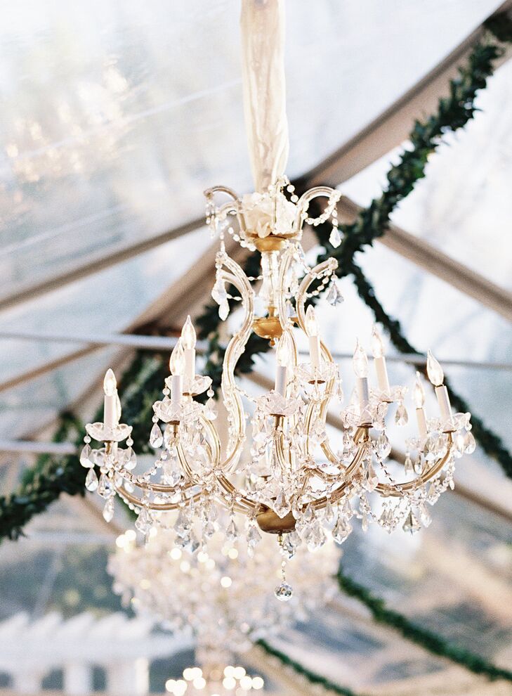 The clear reception tent placed in the gardens was lit with lots of votives and five lavish chandeliers mimicking the internal decor of the Duke Mansion to give the illusion of bringing some of the inside out.